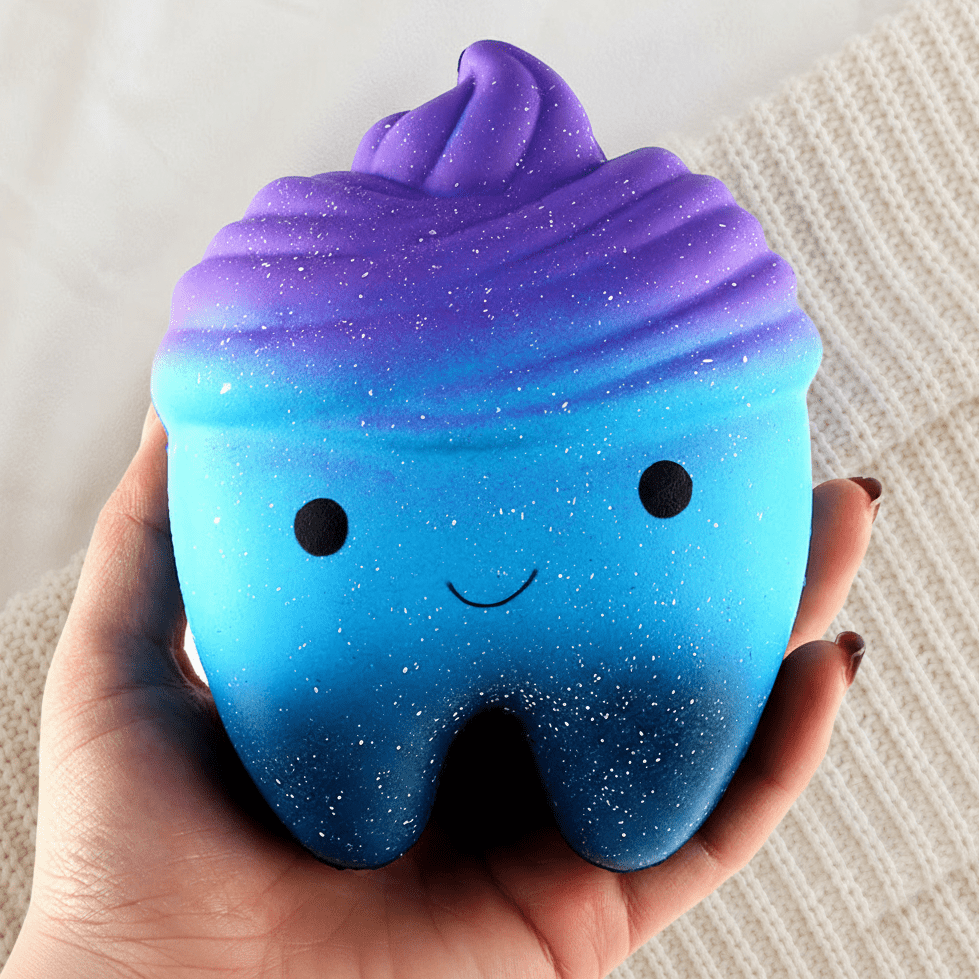 Galaxy Tooth Squishy Cradled on Knit Background